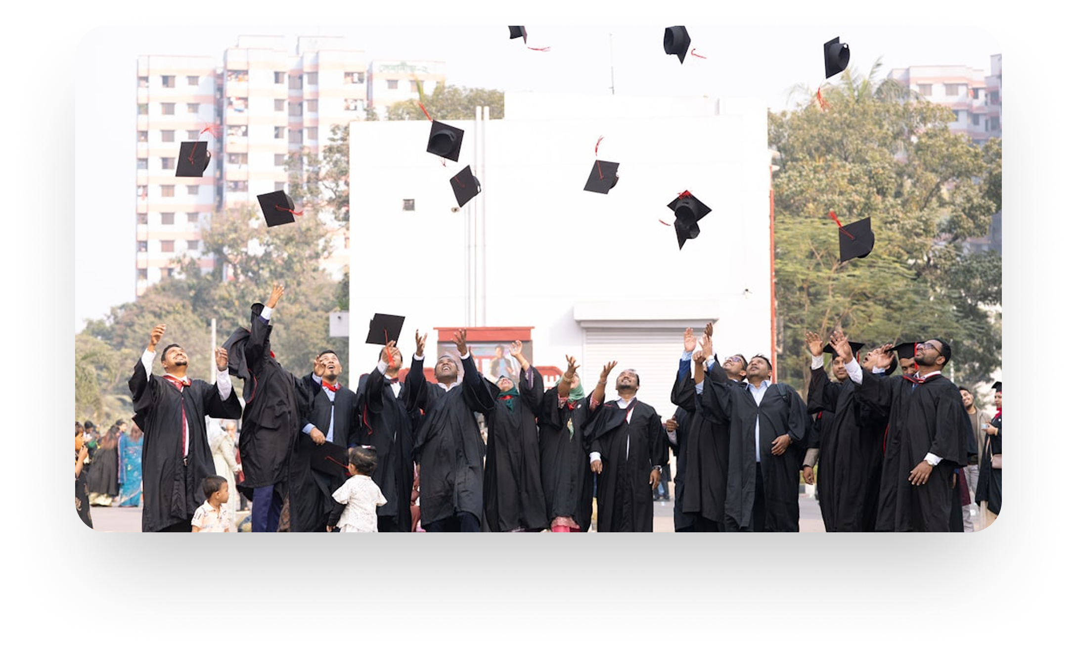 Graduating students throwing caps